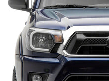 Load image into Gallery viewer, Raxiom 12-15 Toyota Tacoma Axial Series Headlights w/ LED Bar- Black Housing (Clear Lens)