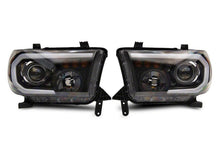 Load image into Gallery viewer, Raxiom 07-13 Toyota Tundra Axial Projector Headlights w/ SEQL LED Bar- Black Housing (Clear Lens)