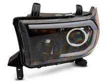 Load image into Gallery viewer, Raxiom 07-13 Toyota Tundra Axial Series Projector Headlights w/ LED Bar- Black Housing (Clear Lens)