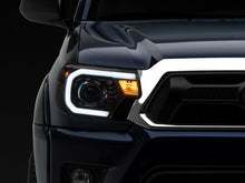 Load image into Gallery viewer, Raxiom 12-15 Toyota Tacoma Axial Series Projector Headlights w/ LED Bar- Black Housing (Clear Lens)