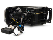 Load image into Gallery viewer, Raxiom 02-05 Dodge RAM 1500 LED Projector Headlights w/ SEQL LED Bar- Black Housing (Clear Lens)