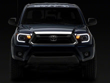 Load image into Gallery viewer, Raxiom 12-15 Toyota Tacoma Axial Projector Headlights w/ SEQL LED Bar- Black Housing (Clear Lens)