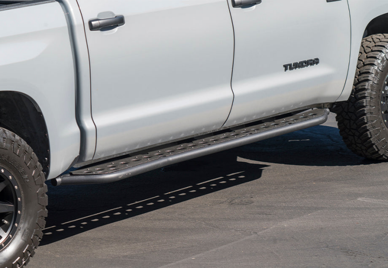 Cali Raised 14-21 Toyota Tundra Step Ed Rock Sliders - No Kick Out/PwdrCoat Plate/BedLiner