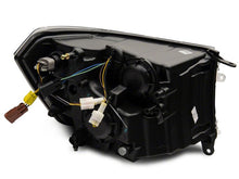Load image into Gallery viewer, Raxiom 09-18 Dodge RAM 1500/2500/3500 Axial Headlights w/ SEQL LED Bar- Black Housing (Clear Lens)