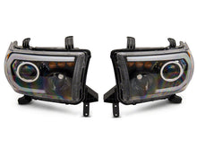 Load image into Gallery viewer, Raxiom 07-13 Toyota Tundra Axial Series Projector Headlights w/ LED Bar- Black Housing (Clear Lens)