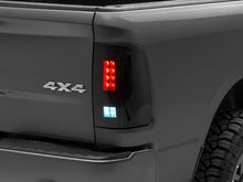Load image into Gallery viewer, Raxiom 09-18 Dodge RAM 1500/2500/3500 Axial Series LED Tail Lights- Black Housing (Smoked Lens)