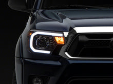 Load image into Gallery viewer, Raxiom 12-15 Toyota Tacoma Axial Projector Headlights w/ SEQL LED Bar- Black Housing (Clear Lens)