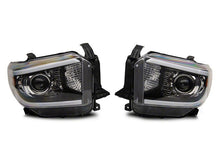 Load image into Gallery viewer, Raxiom 14-21 Toyota Tundra Axial Series Projector Headlights w/ LED Bar- Black Housing (Clear Lens)