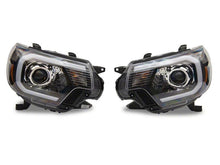 Load image into Gallery viewer, Raxiom 12-15 Toyota Tacoma Axial Projector Headlights w/ SEQL LED Bar- Black Housing (Clear Lens)