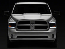 Load image into Gallery viewer, Raxiom 09-18 Dodge RAM 1500/2500/3500 Axial Series Headlights w/ LED Bar- Black Housing (Clear Lens)