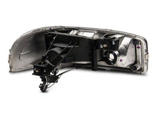 Load image into Gallery viewer, Raxiom 99-06 GMC Sierra 1500 Axial Series Headlights w/ LED Bar- Black Housing (Clear Lens)