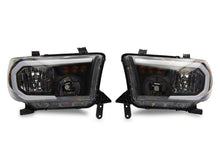 Load image into Gallery viewer, Raxiom 07-13 Toyota Tundra Axial Series Headlights w/ SEQL LED Bar- Black Housing (Clear Lens)