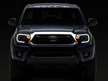 Load image into Gallery viewer, Raxiom 12-15 Toyota Tacoma Axial Series Projector Headlights w/ LED Bar- Black Housing (Clear Lens)
