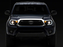 Load image into Gallery viewer, Raxiom 12-15 Toyota Tacoma Axial Series Projector Headlights w/ LED Bar- Black Housing (Clear Lens)