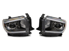 Load image into Gallery viewer, Raxiom 14-21 Toyota Tundra Axial Series Projector Headlights w/ LED Bar- Black Housing (Clear Lens)