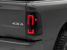 Load image into Gallery viewer, Raxiom 09-18 Dodge RAM 1500/2500/3500 Axial Series LED Tail Lights- Black Housing (Smoked Lens)