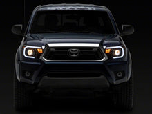 Load image into Gallery viewer, Raxiom 12-15 Toyota Tacoma Axial Projector Headlights w/ SEQL LED Bar- Black Housing (Clear Lens)