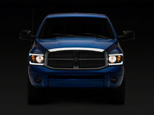 Load image into Gallery viewer, Raxiom 06-09 Dodge RAM 1500/2500/3500 Axial Headlights w/ SEQL LED Bar- Black Housing (Clear Lens)