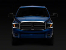 Load image into Gallery viewer, Raxiom 06-09 Dodge RAM 1500/2500/3500 Axial Headlights w/ SEQL LED Bar- Black Housing (Clear Lens)