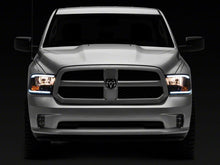 Load image into Gallery viewer, Raxiom 09-18 Dodge RAM 1500/2500/3500 Axial Series Headlights w/ LED Bar- Black Housing (Clear Lens)