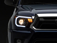 Load image into Gallery viewer, Raxiom 12-15 Toyota Tacoma Axial Projector Headlights w/ SEQL LED Bar- Black Housing (Clear Lens)