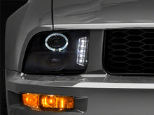 Load image into Gallery viewer, Raxiom 05-09 Ford Mustang Excluding GT500 LED Halo Projector Headlights- Black Housing (Clear Lens)