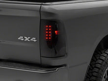 Load image into Gallery viewer, Raxiom 09-18 Dodge RAM 1500/2500/3500 Axial Series LED Tail Lights- Black Housing- Smoked Lens