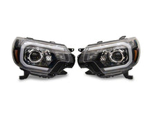 Load image into Gallery viewer, Raxiom 12-15 Toyota Tacoma Axial Series Projector Headlights w/ LED Bar- Black Housing (Clear Lens)