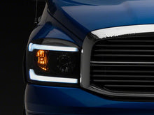 Load image into Gallery viewer, Raxiom 06-09 Dodge RAM 1500/2500/3500 Axial Headlights w/ SEQL LED Bar- Black Housing (Clear Lens)