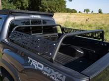 Load image into Gallery viewer, Cali Raised 05-23 Toyota Tacoma Overland Bed Bars - 11 Bars Molle Panel Powder Coat Finish