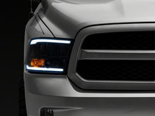Load image into Gallery viewer, Raxiom 09-18 Dodge RAM 1500/2500/3500 Axial Series Headlights w/ LED Bar- Black Housing (Clear Lens)