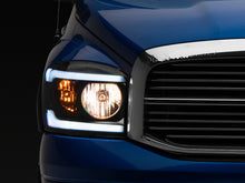 Load image into Gallery viewer, Raxiom 06-09 Dodge RAM 1500/2500/3500 Axial Headlights w/ SEQL LED Bar- Black Housing (Clear Lens)