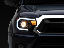 Load image into Gallery viewer, Raxiom 12-15 Toyota Tacoma Axial Series Projector Headlights w/ LED Bar- Black Housing (Clear Lens)