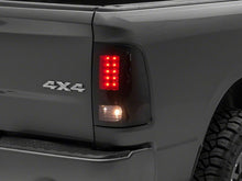 Load image into Gallery viewer, Raxiom 09-18 Dodge RAM 1500/2500/3500 Axial Series LED Tail Lights- Black Housing- Smoked Lens