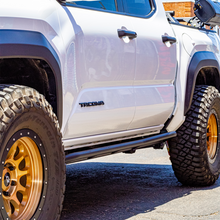 Load image into Gallery viewer, Cali Raised 2024+ Toyota Tacoma Trail Ed Rock Sliders - Double Cab Long Bed/Kick Out/PwdrCoat