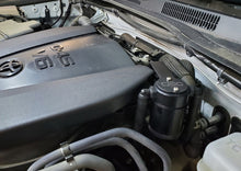 Load image into Gallery viewer, J&amp;L 16-23 Toyota Tacoma 3.5L Driver Side Oil Separator 3.0 - Black Anodized - GTR Auto